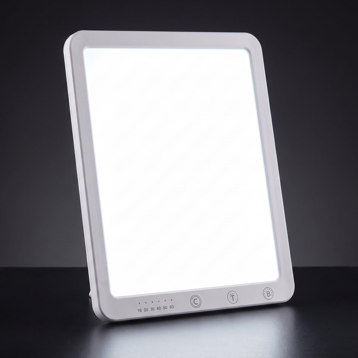 Lampe lumière du jour 10 000 lux allumée, panneau LED blanc à coins arrondis avec trois touches tactiles