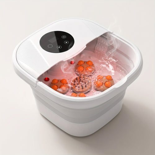 Bain de pieds pliable blanc rempli d'eau chaude, avec bulles et plateaux de massage à boules orange